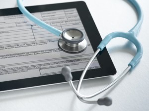 Studio shot of stethoscope and digital tablet with medical form