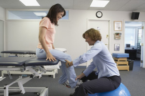 Female physical therapist with patient